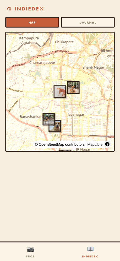 The IndieDex map screen: photos of street dogs pinned on a map of south Bengaluru